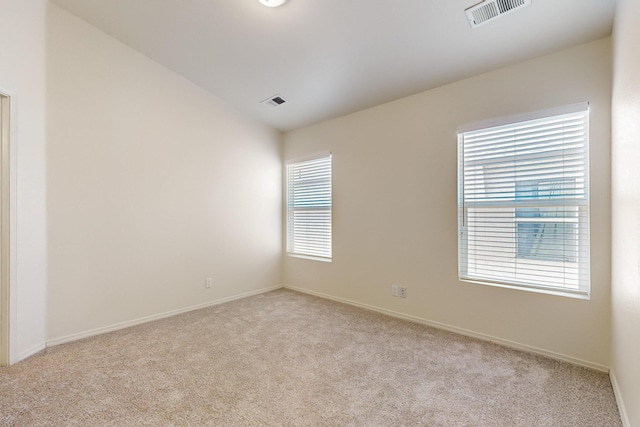 6501 San Antonio Dr NE Unit 2702, Albuquerque, NM 87109 - unfurnished room featuring light carpet and baseboards
