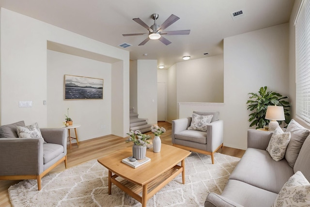 6501 San Antonio Dr NE Unit 2702, Albuquerque, NM 87109 - living room with light wood-type flooring, a ceiling fan, and stairway