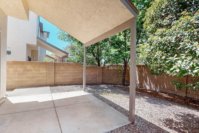 6501 San Antonio Dr NE Unit 2702, Albuquerque, NM 87109 - fenced backyard with a patio
