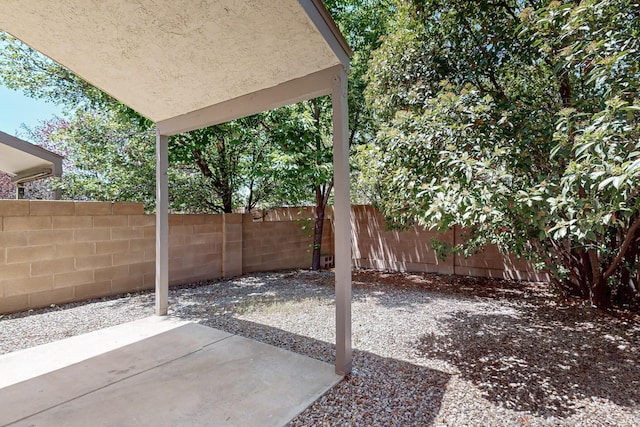 6501 San Antonio Dr NE Unit 2702, Albuquerque, NM 87109 - fenced backyard with a patio