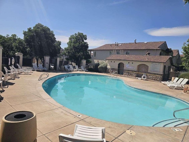 6501 San Antonio Dr NE Unit 2702, Albuquerque, NM 87109 - community pool featuring a patio