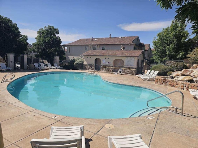 6501 San Antonio Dr NE Unit 2702, Albuquerque, NM 87109 - community pool featuring a patio