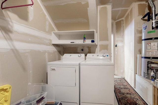 6501 San Antonio Dr NE Unit 2702, Albuquerque, NM 87109 - laundry room with washing machine and dryer and secured water heater