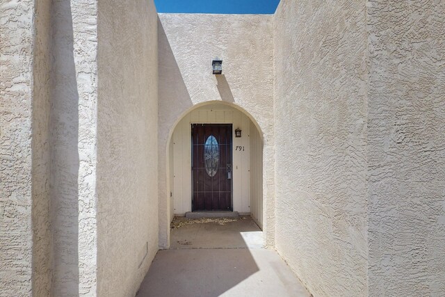 791 Stallion Rd SE, Rio Rancho, NM 87124 - property entrance featuring stucco siding