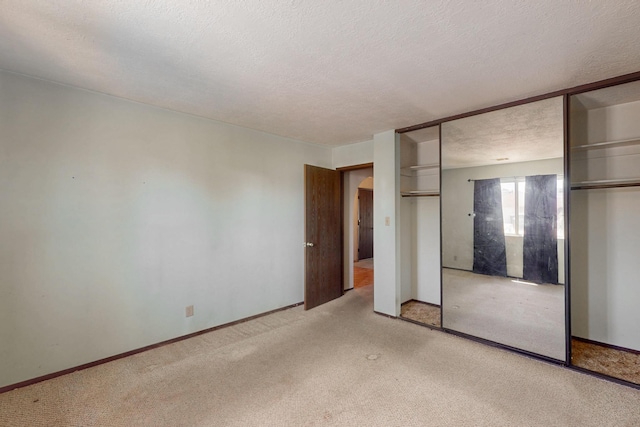 791 Stallion Rd SE, Rio Rancho, NM 87124 - unfurnished bedroom with a textured ceiling and light colored carpet