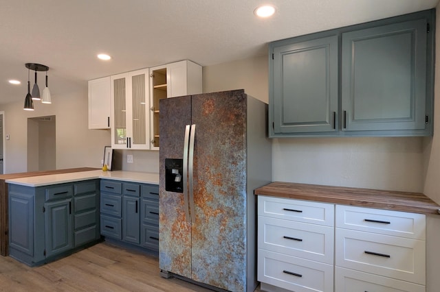 10031 Guadalupe Trl NW Unit A, Albuquerque, NM 87114 - kitchen featuring stainless steel fridge with ice dispenser, a peninsula, light wood-style floors, butcher block countertops, and recessed lighting