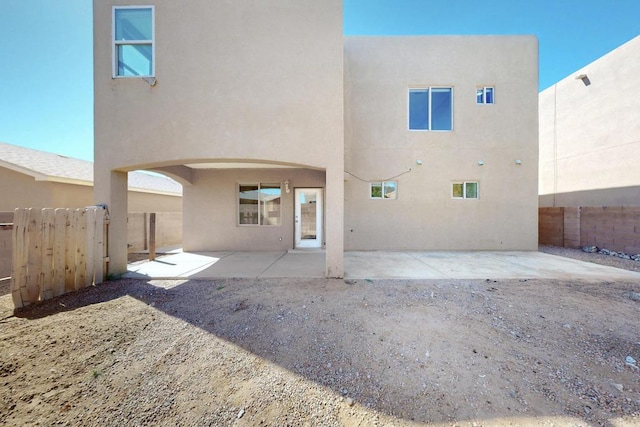 6505 Basket Weaver Ave NW, Albuquerque, NM 87114 - back of property featuring stucco siding and a patio area
