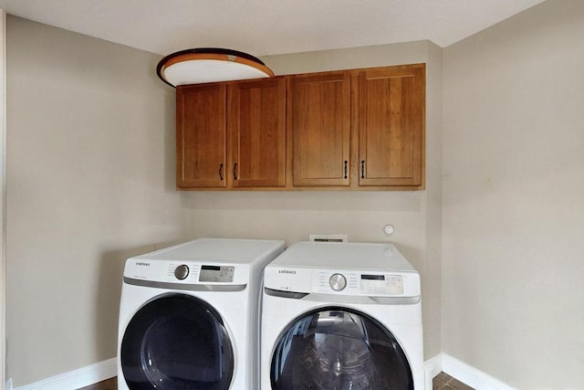 6505 Basket Weaver Ave NW, Albuquerque, NM 87114 - washroom with cabinet space, independent washer and dryer, and baseboards
