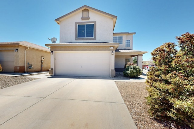 9731 Puccini Trl NW, Albuquerque, NM 87114 - traditional-style house featuring stucco siding, an attached garage, and concrete driveway