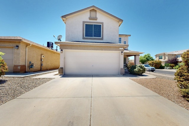 9731 Puccini Trl NW, Albuquerque, NM 87114 - traditional-style home featuring stucco siding, driveway, and a garage