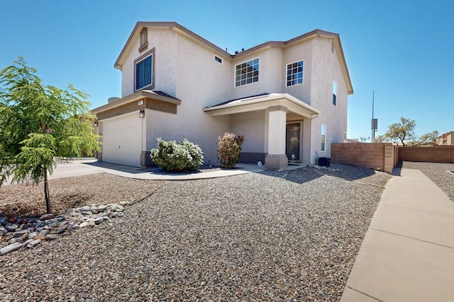9731 Puccini Trl NW, Albuquerque, NM 87114 - view of front of property with a garage, stucco siding, and concrete driveway