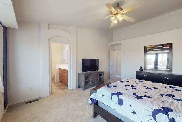 9731 Puccini Trl NW, Albuquerque, NM 87114 - bedroom featuring light colored carpet, ensuite bathroom, baseboards, and ceiling fan