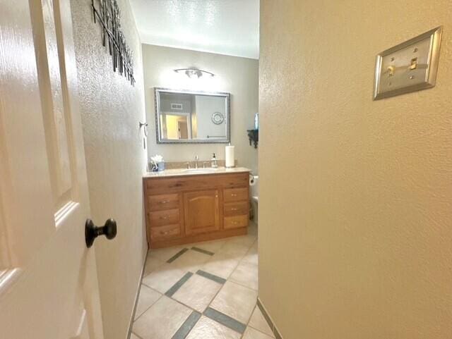 2119 Besler Ln SW, Albuquerque, NM 87105 - bathroom with vanity and a textured wall