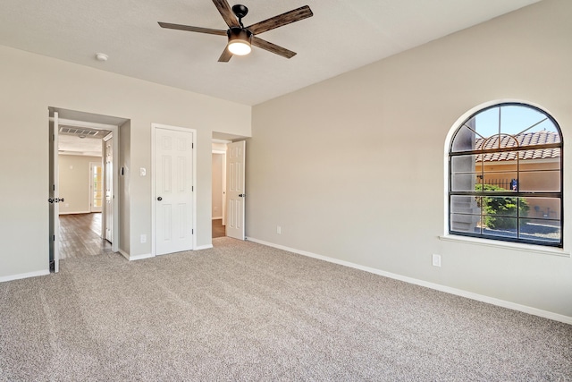 564 Nicklaus Dr SE, Rio Rancho, NM 87124 - unfurnished bedroom with carpet flooring, baseboards, and a ceiling fan