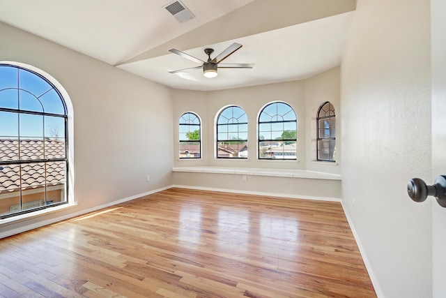 564 Nicklaus Dr SE, Rio Rancho, NM 87124 - empty room with wood finished floors, a ceiling fan, and baseboards