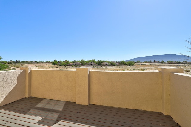 564 Nicklaus Dr SE, Rio Rancho, NM 87124 - wooden deck with a mountain view