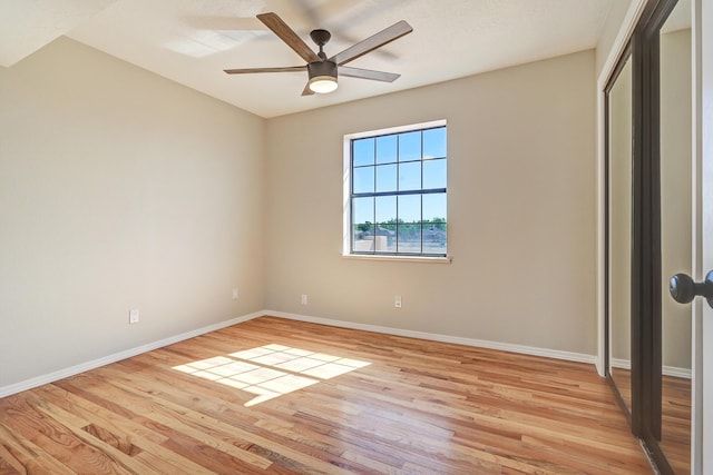 564 Nicklaus Dr SE, Rio Rancho, NM 87124 - unfurnished bedroom with light wood-style floors, baseboards, a closet, and ceiling fan