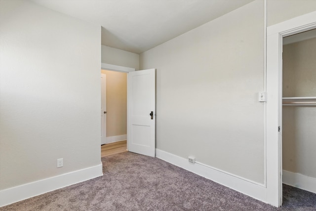 417 8th St NW, Albuquerque, NM 87102 - unfurnished bedroom with carpet, baseboards, and a closet