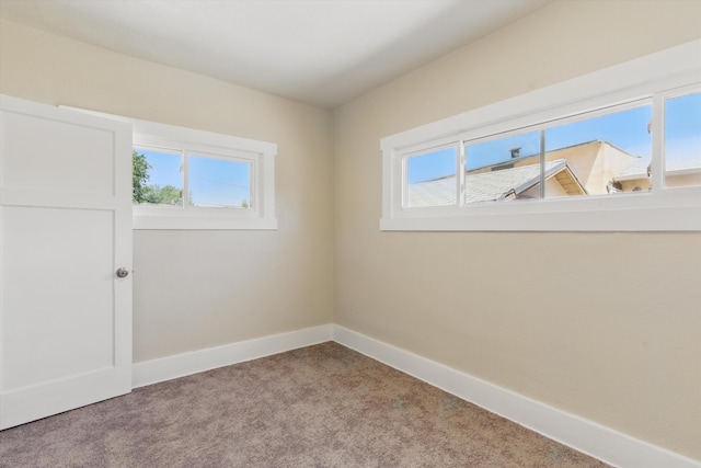 417 8th St NW, Albuquerque, NM 87102 - carpeted empty room with plenty of natural light and baseboards
