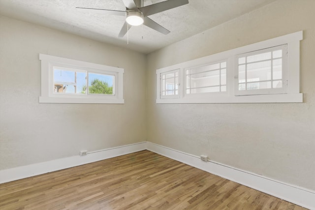 417 8th St NW, Albuquerque, NM 87102 - empty room with wood finished floors, baseboards, and ceiling fan