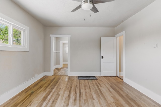 417 8th St NW, Albuquerque, NM 87102 - empty room with light wood-style floors, baseboards, and ceiling fan