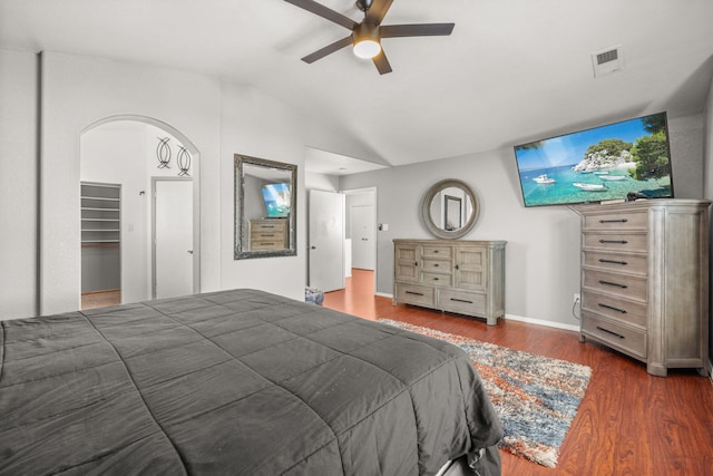10119 Corral Gate Ln SW, Albuquerque, NM 87121 - bedroom with vaulted ceiling, wood finished floors, ceiling fan, and arched walkways