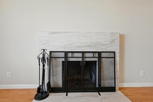 9722 Apache Ave NE, Albuquerque, NM 87112 - detailed view of a fireplace, baseboards, and wood finished floors