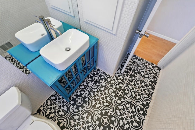9722 Apache Ave NE, Albuquerque, NM 87112 - half bathroom featuring toilet, wood finished floors, baseboards, and vanity