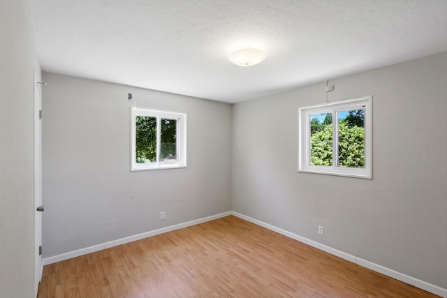 9722 Apache Ave NE, Albuquerque, NM 87112 - empty room with light wood finished floors and baseboards