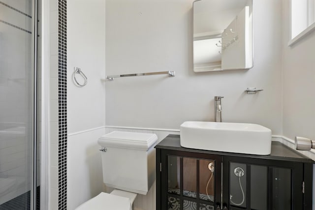 9722 Apache Ave NE, Albuquerque, NM 87112 - full bath with vanity, a shower stall, and wainscoting