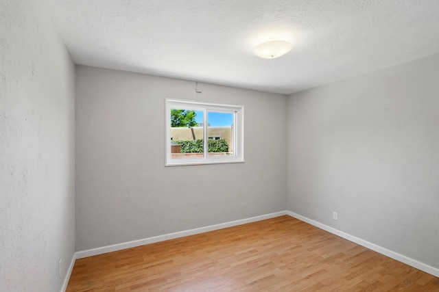 9722 Apache Ave NE, Albuquerque, NM 87112 - spare room with light wood-style flooring and baseboards
