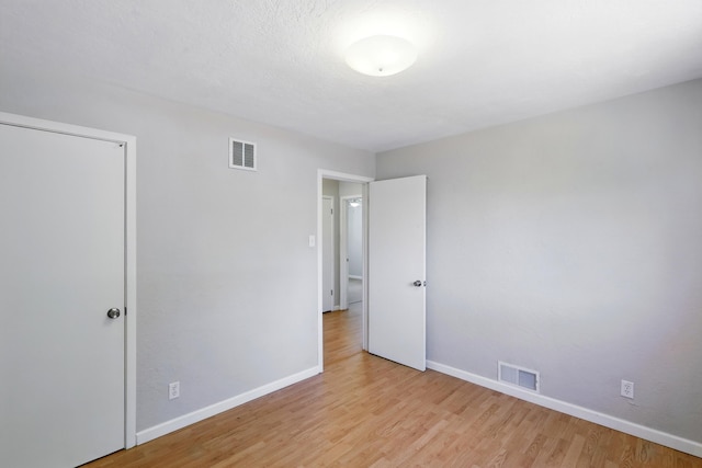 9722 Apache Ave NE, Albuquerque, NM 87112 - unfurnished bedroom featuring baseboards and light wood-style flooring