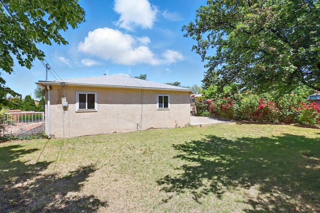 9722 Apache Ave NE, Albuquerque, NM 87112 - rear view of house with stucco siding and a patio area