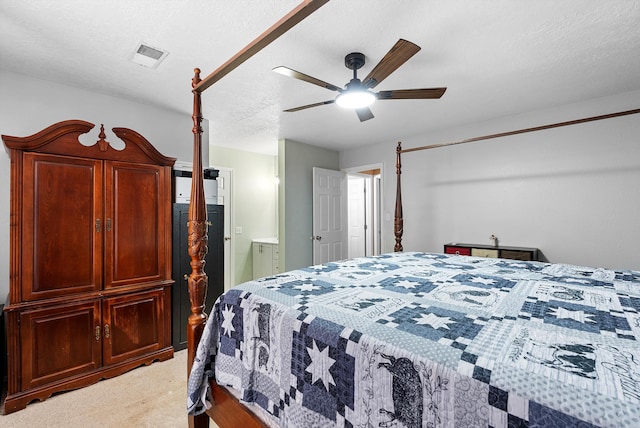 437 7th Ave NE, Rio Rancho, NM 87124 - bedroom with light carpet, a ceiling fan, and ensuite bath