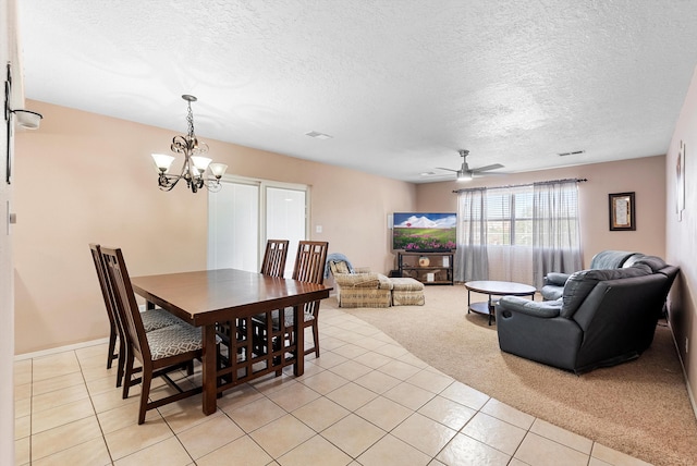 437 7th Ave NE, Rio Rancho, NM 87124 - dining room featuring light tile patterned flooring, a textured ceiling, a chandelier, ceiling fan, and light carpet
