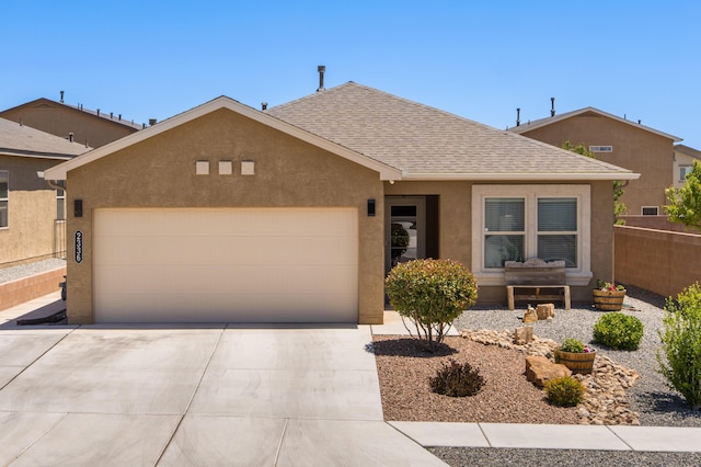 2336 Del Timbre Ln SW, Albuquerque, NM 87121 - ranch-style house featuring driveway, a garage, roof with shingles, and stucco siding