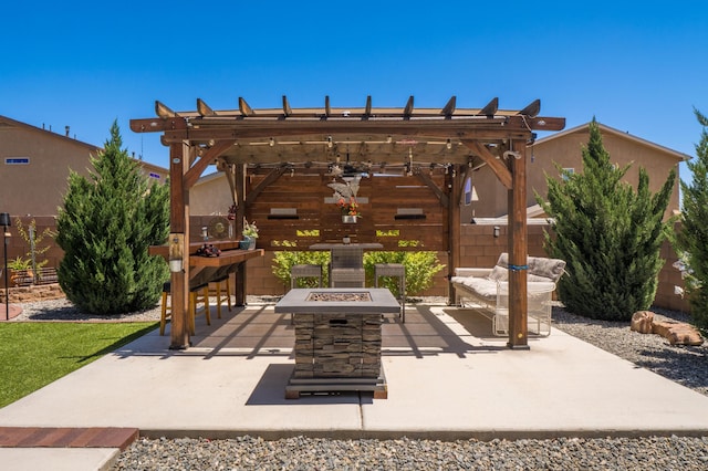 2336 Del Timbre Ln SW, Albuquerque, NM 87121 - view of patio featuring an outdoor fire pit and a pergola