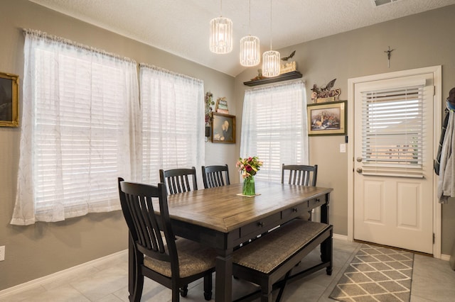 2336 Del Timbre Ln SW, Albuquerque, NM 87121 - dining room with baseboards, a textured ceiling, and a chandelier