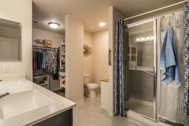 2336 Del Timbre Ln SW, Albuquerque, NM 87121 - full bathroom with toilet, a shower stall, tile patterned floors, a textured ceiling, and vanity