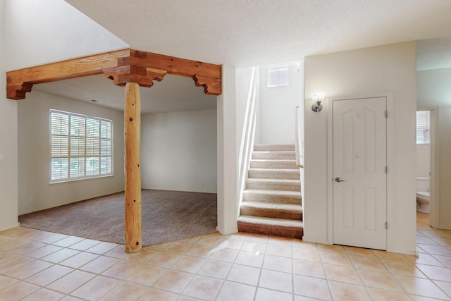 5124 Pyrite Pl NW, Albuquerque, NM 87114 - staircase featuring carpet flooring and tile patterned floors