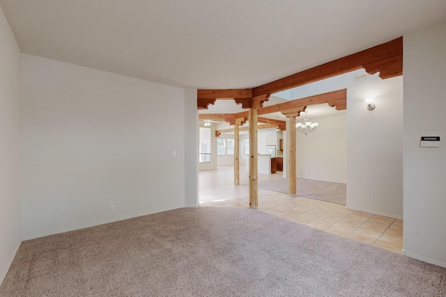 5124 Pyrite Pl NW, Albuquerque, NM 87114 - spare room featuring a chandelier, light colored carpet, beamed ceiling, and light tile patterned floors