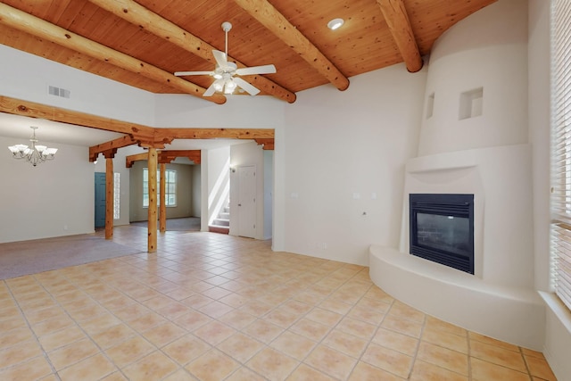 5124 Pyrite Pl NW, Albuquerque, NM 87114 - unfurnished living room with wood ceiling with exposed beams, a glass covered fireplace, stairway, light tile patterned flooring, and a chandelier