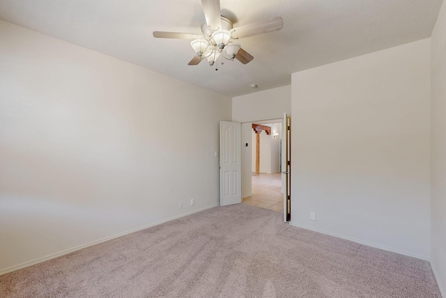 5124 Pyrite Pl NW, Albuquerque, NM 87114 - spare room featuring light carpet, a ceiling fan, and baseboards