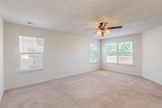5124 Pyrite Pl NW, Albuquerque, NM 87114 - unfurnished room with a textured ceiling, light carpet, a ceiling fan, and baseboards