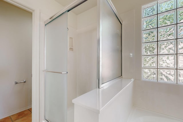 5124 Pyrite Pl NW, Albuquerque, NM 87114 - bathroom featuring a stall shower, a bath, and tile patterned floors