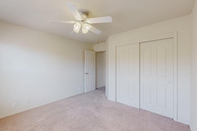 5124 Pyrite Pl NW, Albuquerque, NM 87114 - unfurnished bedroom featuring light carpet, a closet, ceiling fan, and baseboards