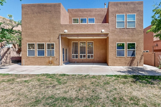 5124 Pyrite Pl NW, Albuquerque, NM 87114 - rear view of house with a patio and stucco siding