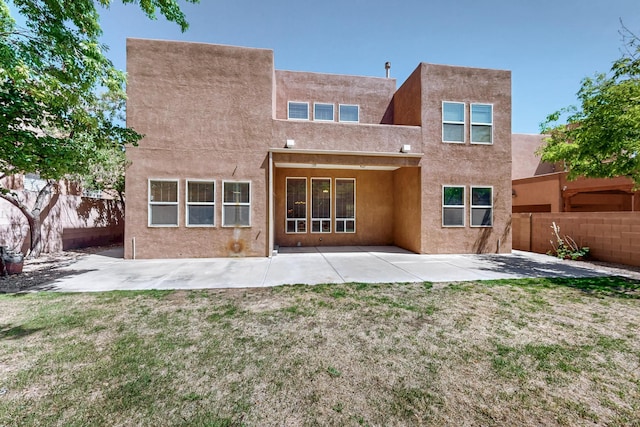 5124 Pyrite Pl NW, Albuquerque, NM 87114 - rear view of house featuring a patio and stucco siding