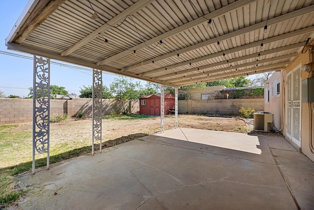 7609 Hannett Ave NE, Albuquerque, NM 87110 - fenced backyard with a patio and central air condition unit