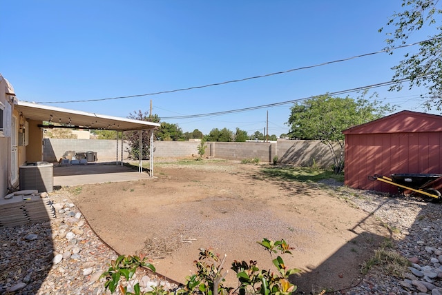 7609 Hannett Ave NE, Albuquerque, NM 87110 - fenced backyard featuring central AC unit and a patio